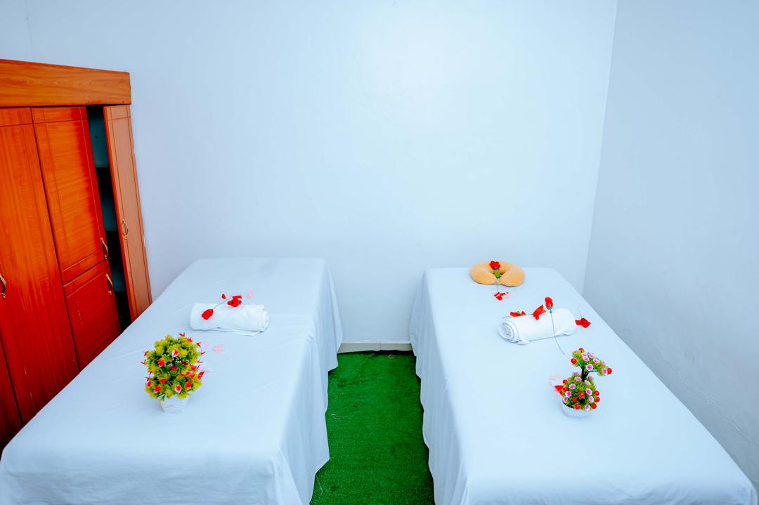 Another couples massage room with side-by-side treatment beds
