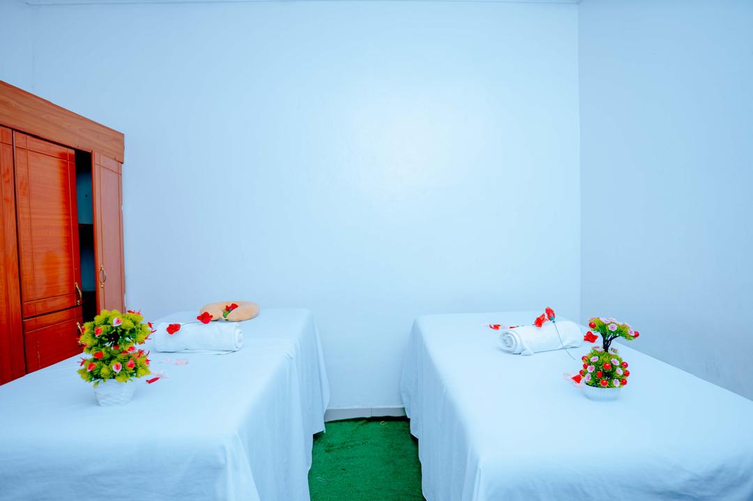 Couples treatment room with rose petals and flowers